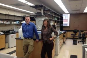 Folding@home Director Greg Bowman steps into an experimental biology laboratory.